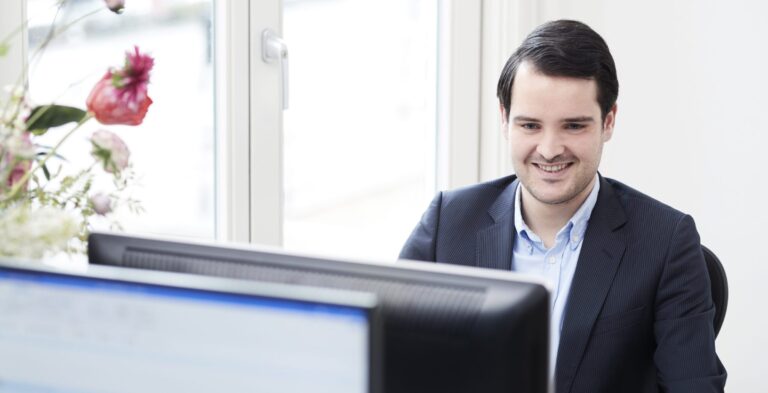 Behind the laptop